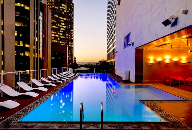 A rooftop pool at sunset