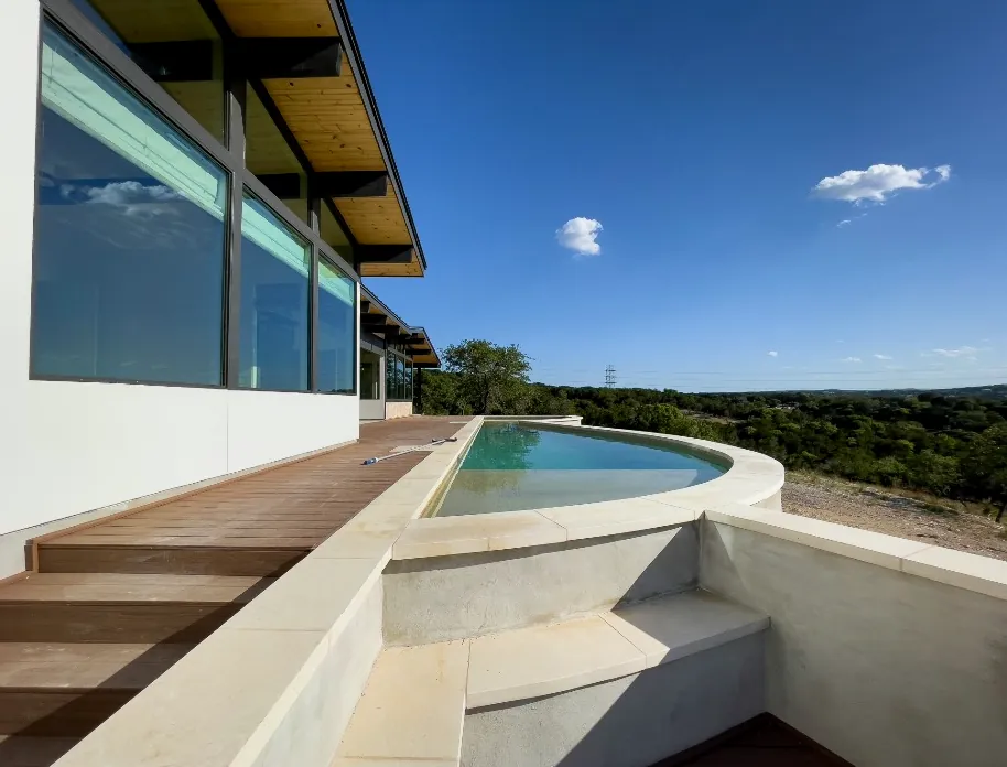 A round terrace pool with a countryside view